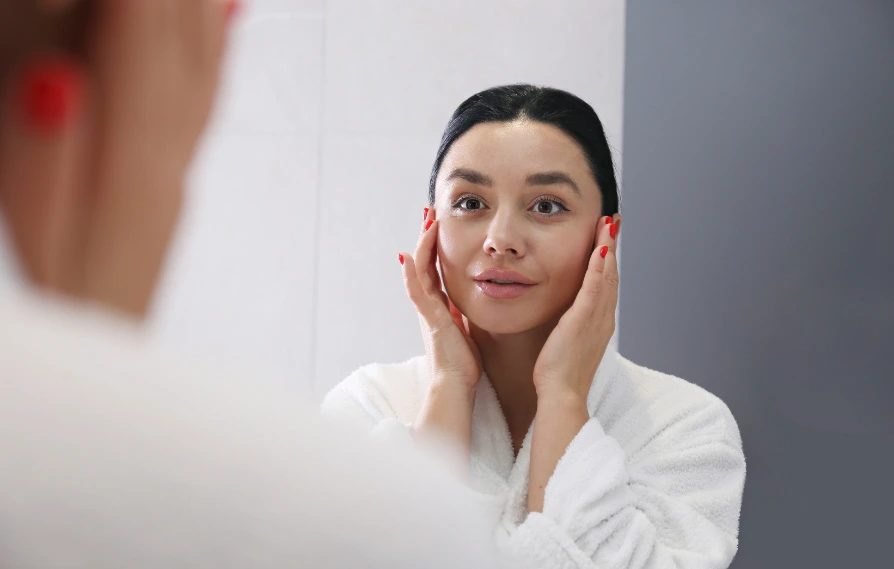 woman smiling in the mirror