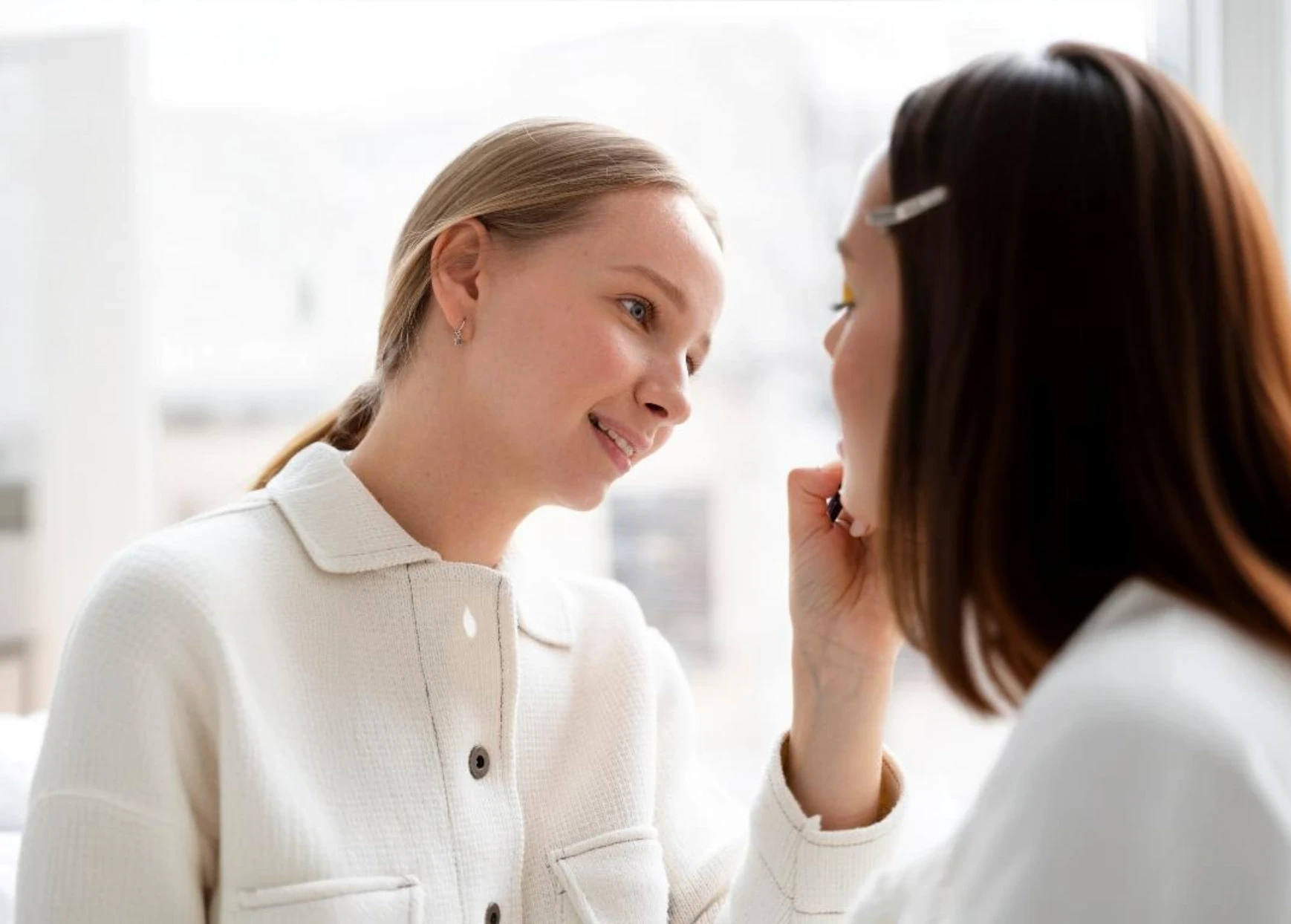 Aesthetician performing a skin treatment on a patient