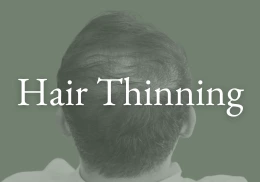 man thinning hair on the crown of his head